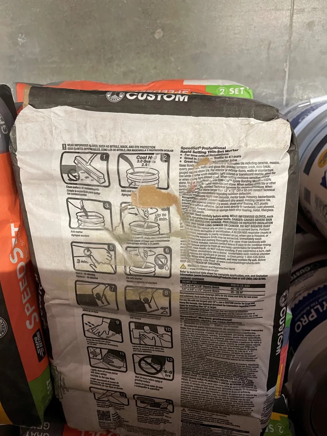 The same bag of thin-set mortar repaired with a Bag Patch, back on the shelf