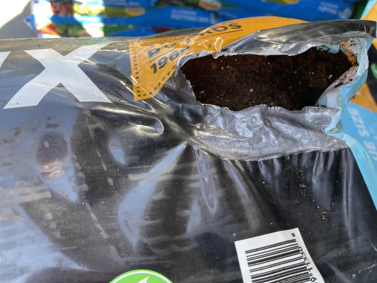 Bag of all-purpose mix with a large hole exposing the contents